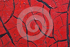 Cracked red paint on grunge metal surface - macro 11