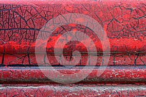 Cracked red paint on grunge metal surface - macro 13