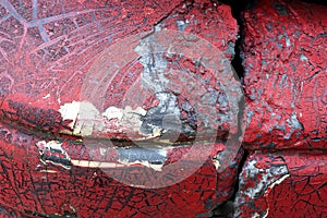 Cracked red paint on grunge metal surface - macro 3