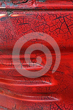 Cracked red paint on grunge metal surface - macro 5