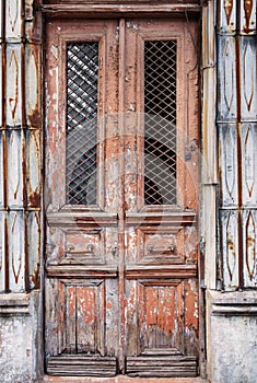 Cracked red paint on old vintage door