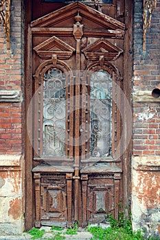 Cracked red paint on old vintage wooden door