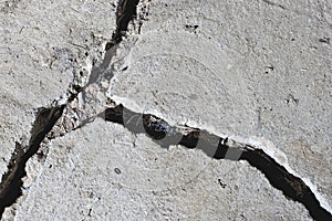 Cracked road concrete close up