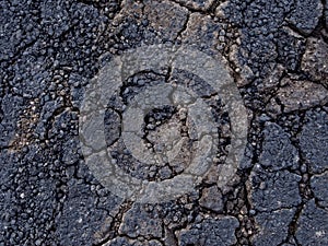 Cracked tarmac texture background