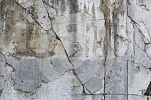 Cracked wall with bullet holes