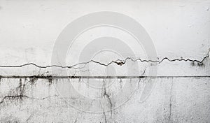Cracked wall, damaged concrete house