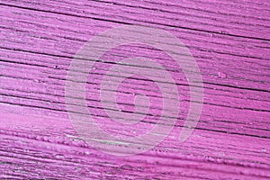 Cracked wooden plank, pink background