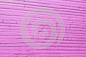 Cracked wooden plank, pink color