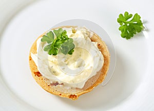 Cracker with cheese spread