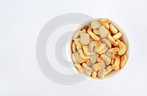 Cracker or Cookie ABC letter alphabet in bowl with copy space on white background