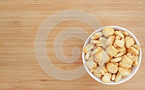 Cracker or Cookie ABC letter alphabet in white bowl on wooden background