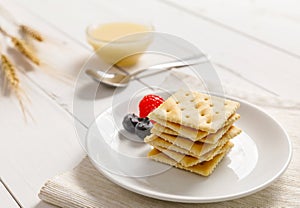 Crackers with condensed milk and fruit, breakfast