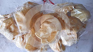 Crackers in plastic bags are snacks that are generally made from tapioca flour mixed with flavoring ingredients