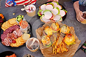 crackers, sausages, sandwiches, french fries and Mini burgers for a party