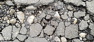 Cracking asphalt on the road