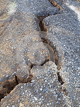 Cracking dirt road collapse.