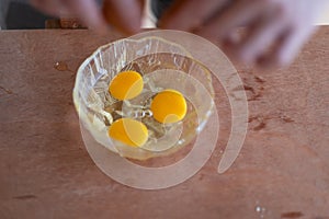 Cracking eggs preparation for cooking.