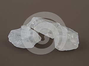 Crackle glass or Sugar quartz beads on a brown background