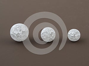 Crackle glass or Sugar quartz beads on a brown background