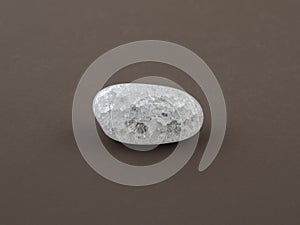 Crackle glass or Sugar quartz beads on a brown background