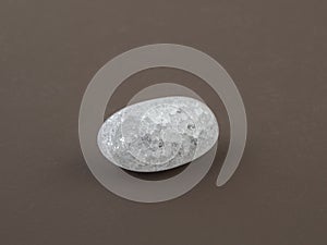 Crackle glass or Sugar quartz beads on a brown background