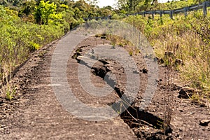 Cracks in the asphalt on an abandoned highway photo