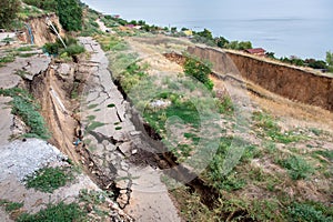 Cracks in the asphalt road due to landslides.