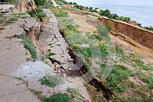 Cracks in the asphalt road due to landslides.