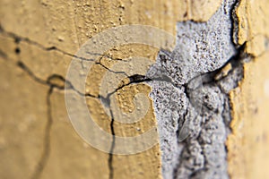 Cracks and chips in the coating plaster walls