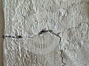 Cracks create damage on the wall.