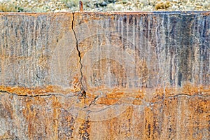 Cracks in the outer wall of a concrete bin at an abandoned mine in Nevada, USA