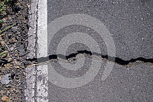 Cracks in road surface in La Palma, Canaries, Spain