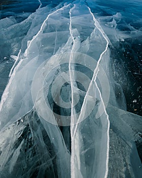 Cracks surface of the frozen lake of Baikal lake in winter season. ice texture cracks baikal
