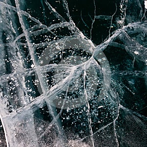 Cracks surface of the frozen lake of Baikal lake in winter season. ice texture cracks baikal