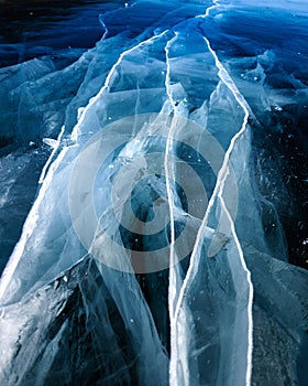 Cracks surface of the frozen lake of Baikal lake in winter season. ice texture cracks baikal