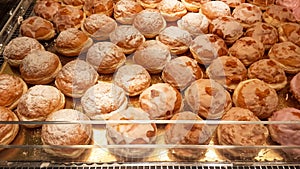 Cracow - A massive counter filled with donuts covered with icing and filled with rose marmalade