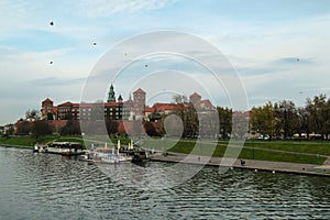 Cracow - A panoramic view on the iconic Wawel Castle in Cracow, Poland and the Vistula river flowing under the castle