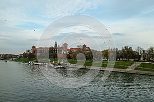 Cracow - A panoramic view on the iconic Wawel Castle in Cracow, Poland and the Vistula river flowing under the castle