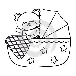 Cradle with toy bear in black and white