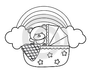 Cradle with toy bear in black and white