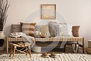 Craetive composition of meditation living room interior with mock up poster frame, beige carpet, colorful pillow, coffee table and