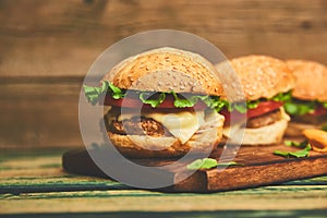 Craft beef burger  on wooden table isolated on black background