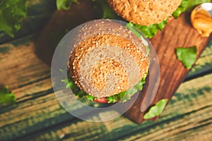 Craft beef burger  on wooden table isolated on black background