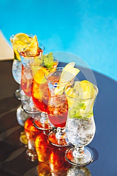 Craft cocktails near the pool. Vacation, summer, holiday, luxury resort concept