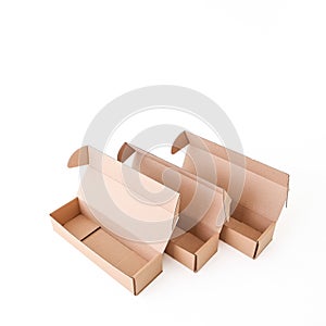 Craft empty boxes are open on a white background. Place for text and logo. The concept of packaging, delivery, food.