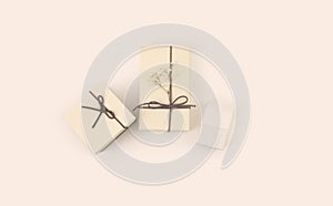Craft empty gift boxes with ribbon on beige copy space horizontal  background. Top view