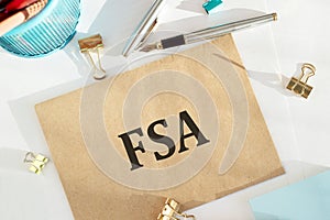 Craft envelope with Flexible Spending Account FSA on an office table