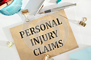 Craft envelope with Tools and Notes with text Personal injury claims