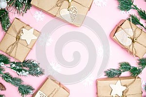 craft gifts with fir twigs on a pink background