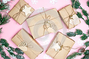 Craft gifts with fir twigs on a pink background